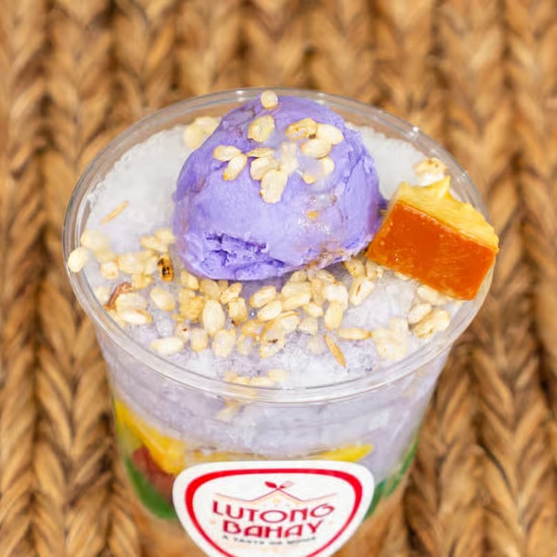 Lutong Bahay's Halo-Halo dessert in a clear cup, topped with purple ube ice cream and cereal.