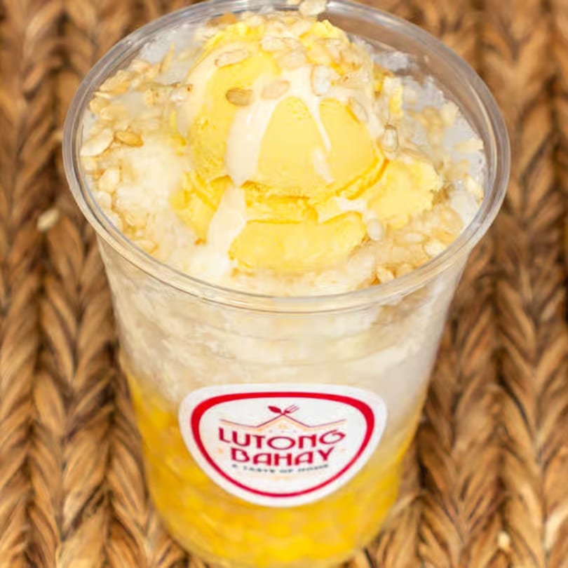 Lutong Bahay's Filipino dessert, Halo-Halo, with yellow ice cream and toppings in a clear cup.
